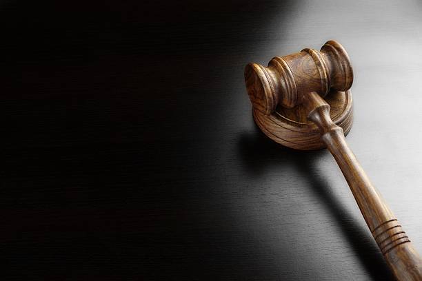 istock Judges Or Auctioneers Walnut Gavel On The Black Table 510872026