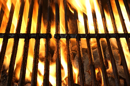 An extreme close up shot of firewood burning inside a grill in a Mexican restaurant.