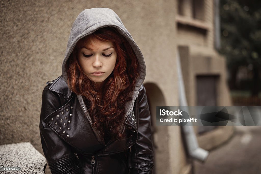 Depression Depressed teenager sitting lonely Teenage Girls Stock Photo
