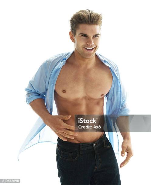 Muscular Man Looking Away Stock Photo - Download Image Now - 20-29 Years, 25-29 Years, Abdominal Muscle