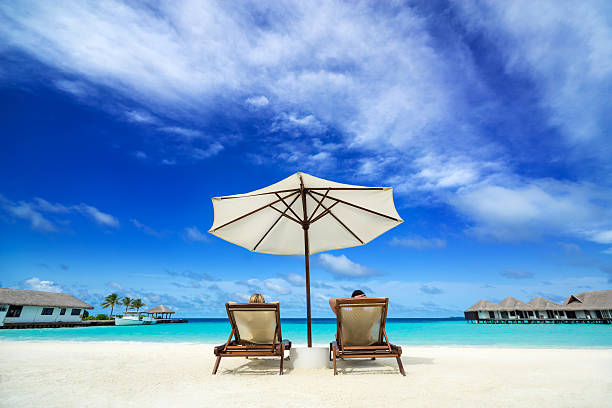 Couple on a tropical beach at Maldives
