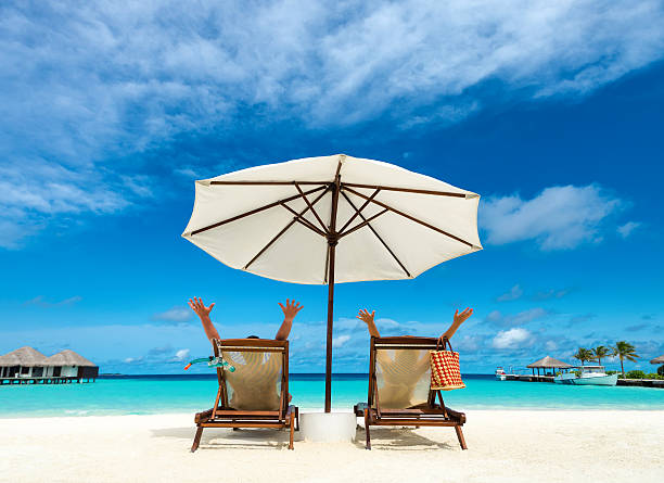 istock Couple on a tropical beach at Maldives 510874647