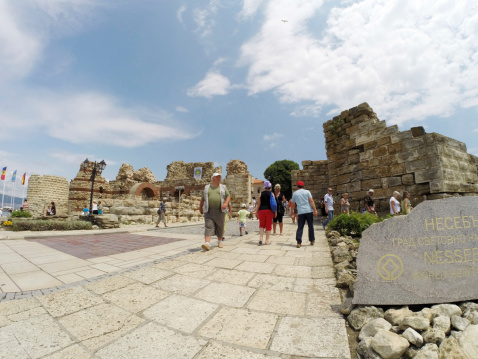 Nessebar, Bulgaria - June 16, 2014: People visit Old Town on June 16, 2014 in Nessebar, Bulgaria. Nessebar in 1956 was declared as museum city, archaeological and architectural reservation by UNESCO.