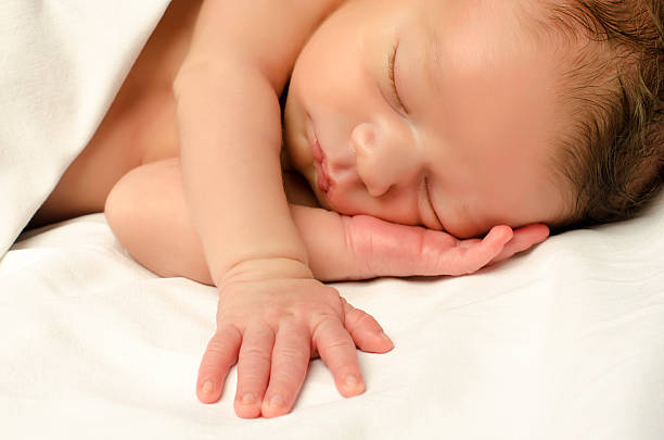 istock Beautiful innocent newborn sleeping. Adorable little boy relaxing 510899363