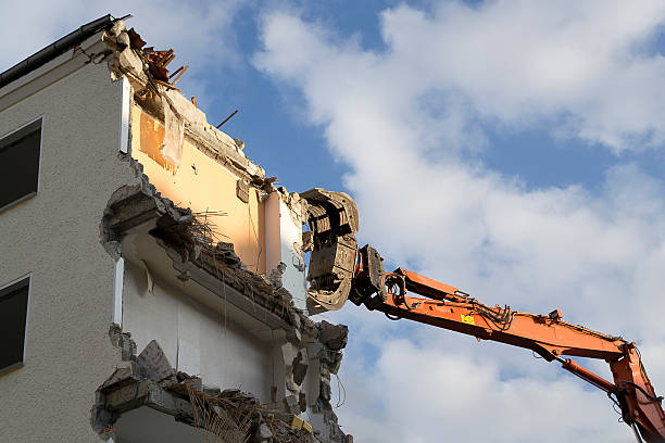 istock House demolition by an excavator 510899635