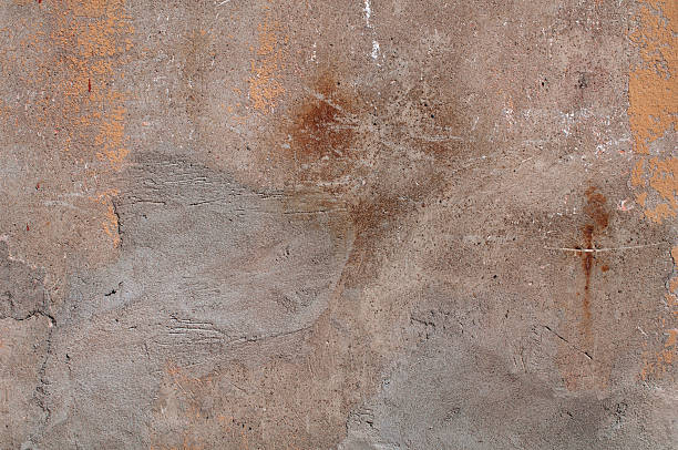 istock Texture of old wall covered with yellow stucco 510901973