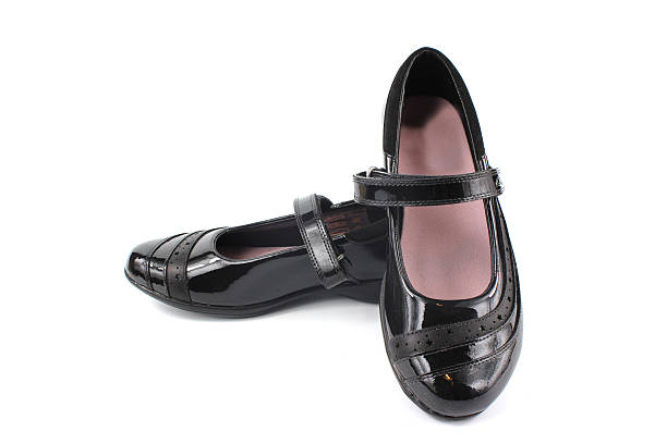 Shiny black patent leather girls shoes stock photo