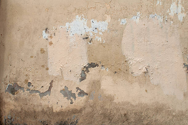 istock Texture of old wall covered with yellow stucco 510902899