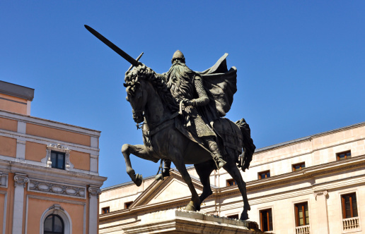 Statue of El Cid mounted on horseback with sword in Burgos