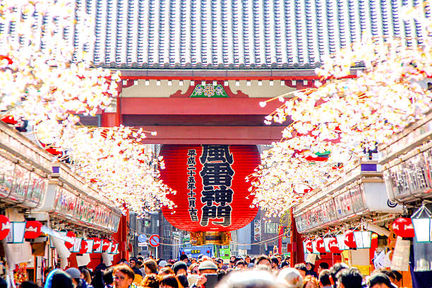 Tokyo, Japan - March 02, 2015 - Sensoji Temple Tokyo, Japan - March 02, 2015 - Big red Japanese lantern around with Cherry Blossom in Sensoji Temple. sensoji stock pictures, royalty-free photos & images