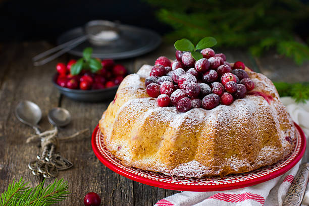 istock cranberry cake decorated with powdered sugar and fresh berries f 510923382