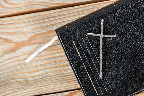 istock Silver christian cross on bible 510923820
