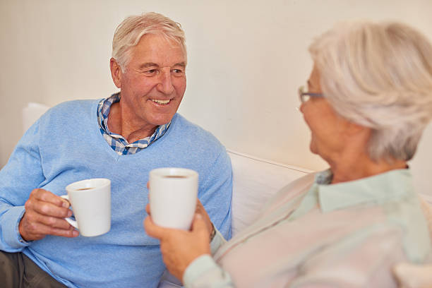 istock Senior couple at home together drinking morning tea 510924914