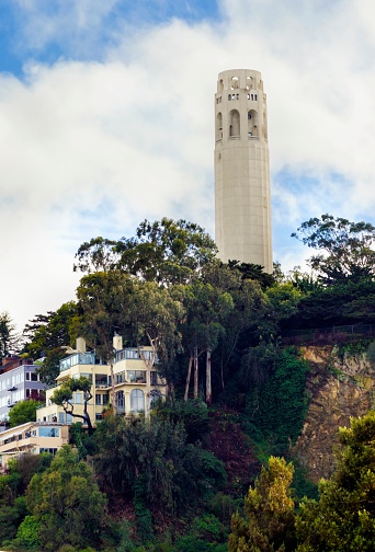 Coit Tower, aka the Lillian Coit Memorial Tower on Telegraph Hill neighborhood of San Francisco, California, United States of America. A view of the flutted white tower from the Fisherman's wharf on the bay.