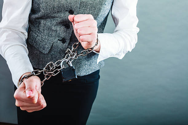 istock Business woman with chained hands 510926256