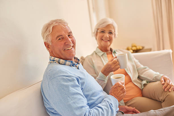 istock Senior couple at home together drinking morning tea 510926862