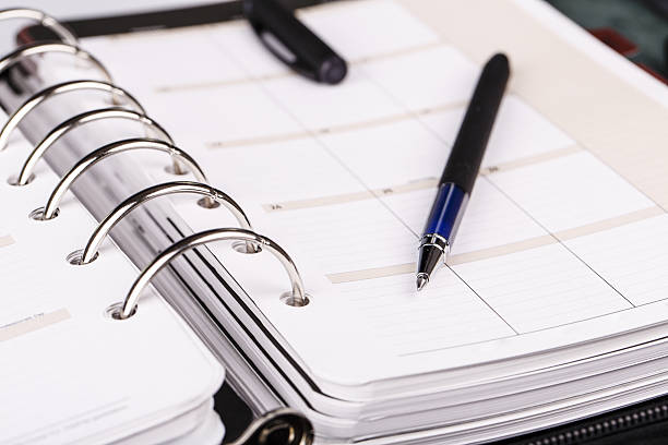 istock Personal organizer or planner with pen on white background 510927012