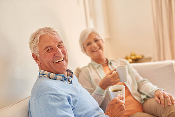 istock Senior couple at home together drinking morning tea 510927476