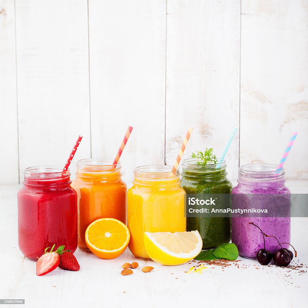 Smoothies, juices, beverages, drinks variety Smoothies, juices, beverages, drinks variety with fresh fruits and berries on a white wooden background. Juice - Drink Stock Photo