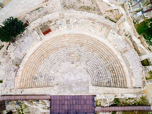 Aerial view of ancient theatre of Kourion Aerial view of the arcaeological site of the ancient city of Kourio which is located in the district of Limassol, Cyprus. A view from the top of the greek roman theatre forming a semicircle. kourion stock pictures, royalty-free photos & images