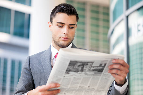 istock Business man reading a newspaper 510948431