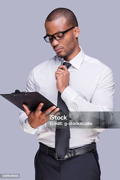 Examining Contract Before Signing Stock Photo - Download Image Now - Clipboard, Expertise, Men