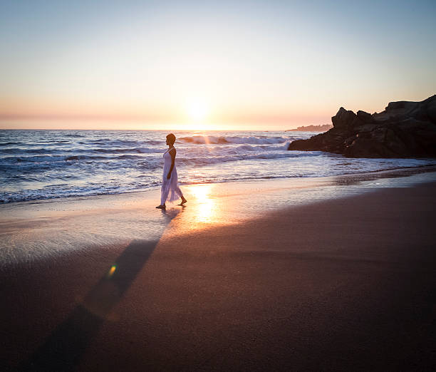 Woman walking on beach