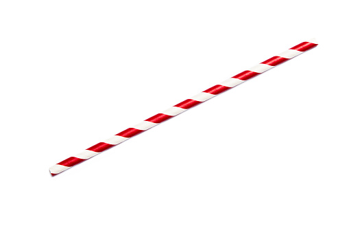 A single red drinking straw in retro style with red and white stripes on white background
