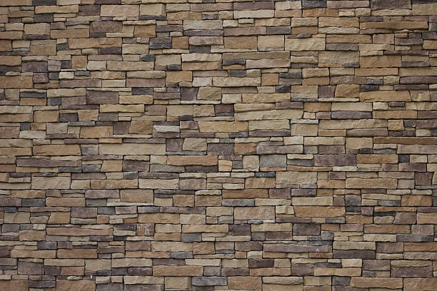 Stone wall background. brown stone brick wall background. brown bricks stock pictures, royalty-free photos & images