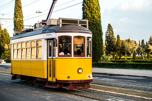 yellow tram in motion