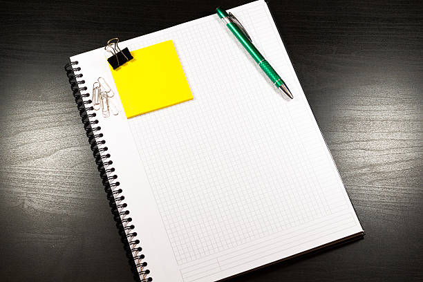 istock Open notebook with blank pages and pencil 510953498