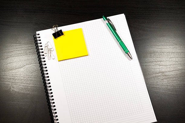 istock Open notebook with blank pages and pencil 510953568