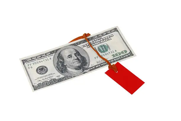 Photo of $ 100 bill with a red tag