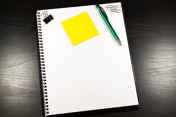 istock Open notebook with blank pages and pencil 510953938