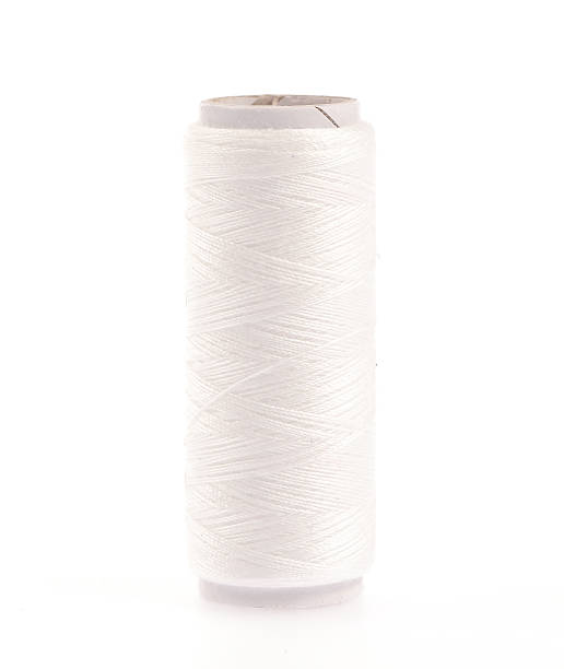 istock Spools of colours threads isolated on white background 510954611