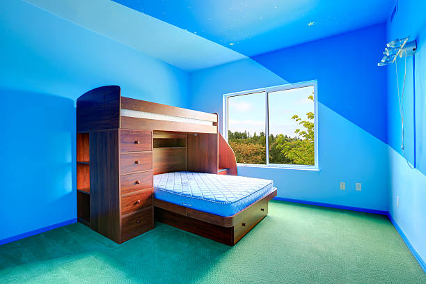 istock Bright blue kids room with loft bed 510955707