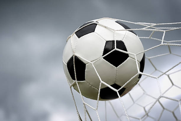istock Soccer ball in goal 510955795