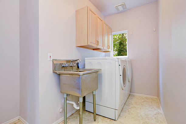 istock Laundry room with old sink and white appliances 510955817