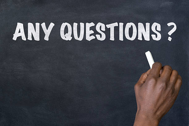 istock Phrase 'Any questions'  written on blackboard 510956694