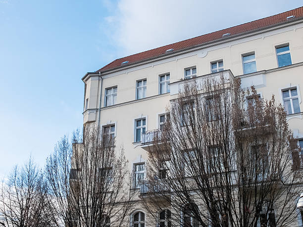 istock Modern Low Rise Apartment with Bare Trees 510956712