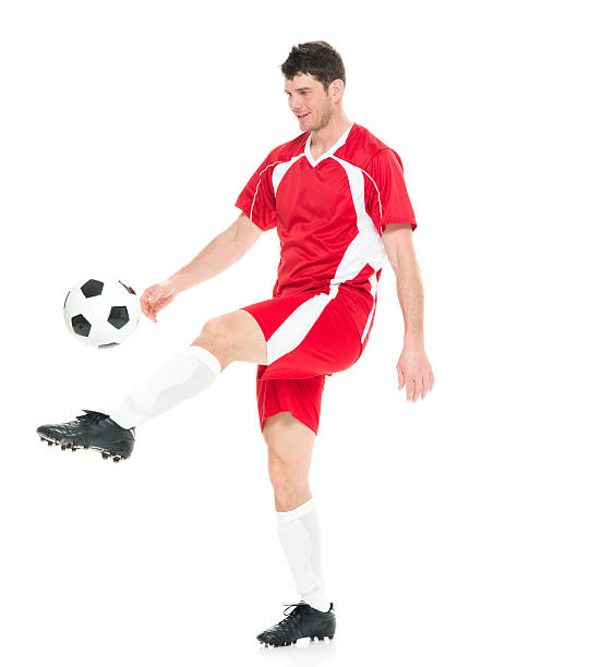 istock Male soccer player juggling 510957796
