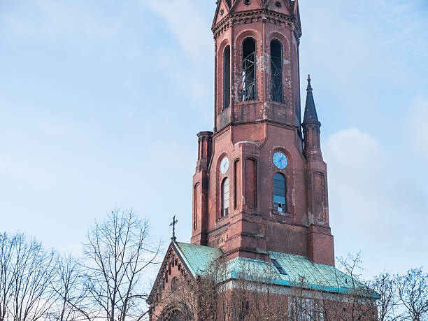 istock Clock tower and steeple of an old church 510957902