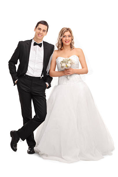 istock Young newlywed couple posing together 510958472