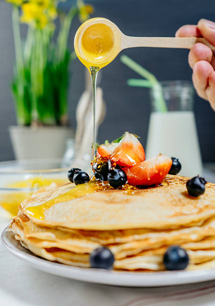 istock Pancakes with strawberry, bluberry and honey 510959512