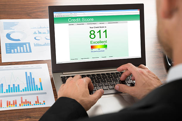 Businessman Checking Credit Score Close-up Of A Businessman Checking Credit Score Online On Laptop credit score photos stock pictures, royalty-free photos & images