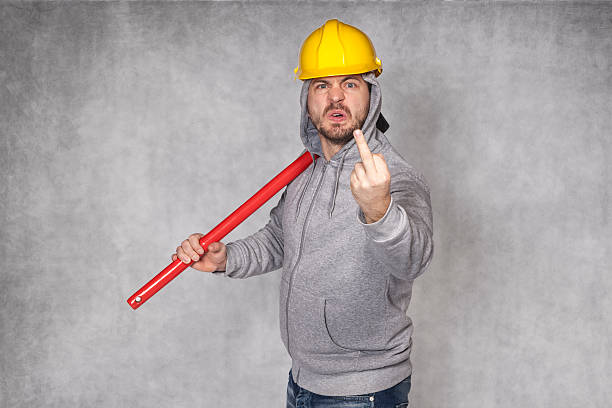 istock angry worker shows the middle finger 510963618