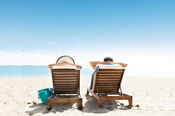 istock Couple Lying On Lounge Chair 510966842