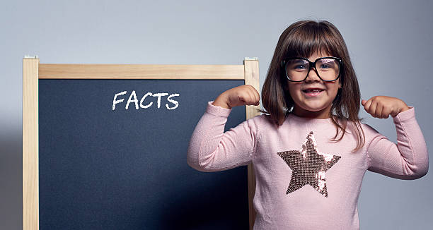 istock nerd girl smiling at camera 510967198