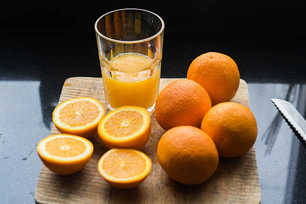 istock half full glas with orange juice 510967782