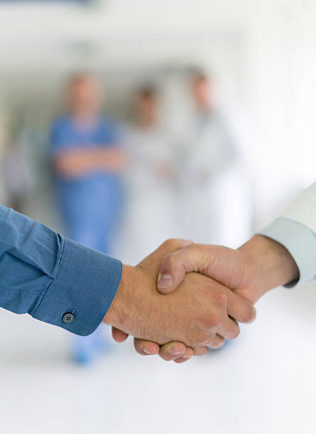 istock Patient handshaking with a doctor 510968694